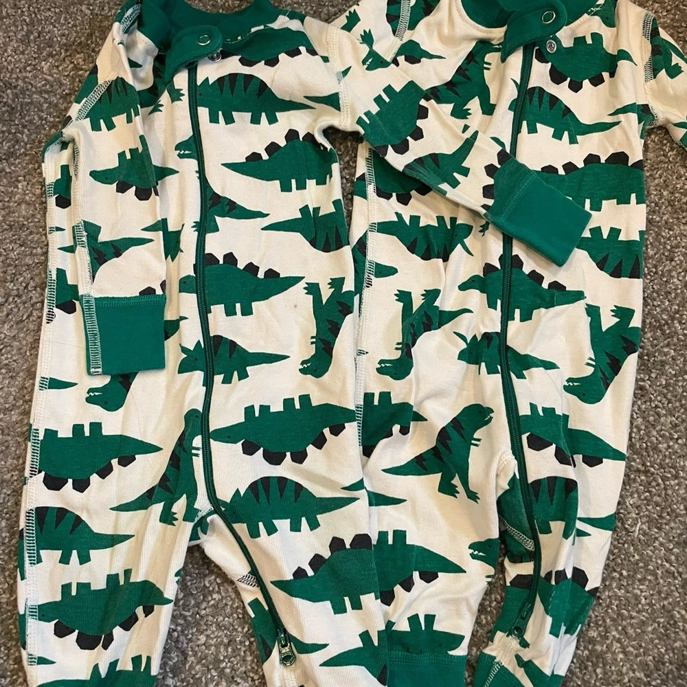 Hanna Anderson. Two pairs. Small stains on one pair. Dinosaur Print Baby Onesies